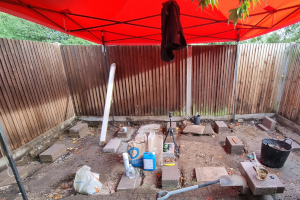 Laying the first concrete blocks