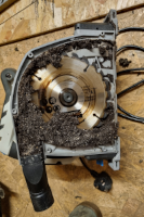 A circular saw full of cladding dust